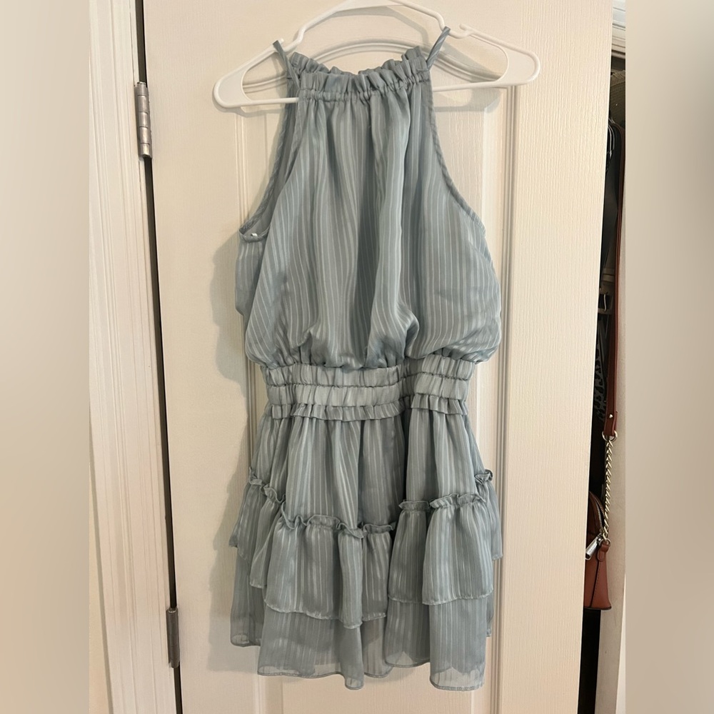 I Just Have To Have it baby blue halter dress with rouching in the middle.